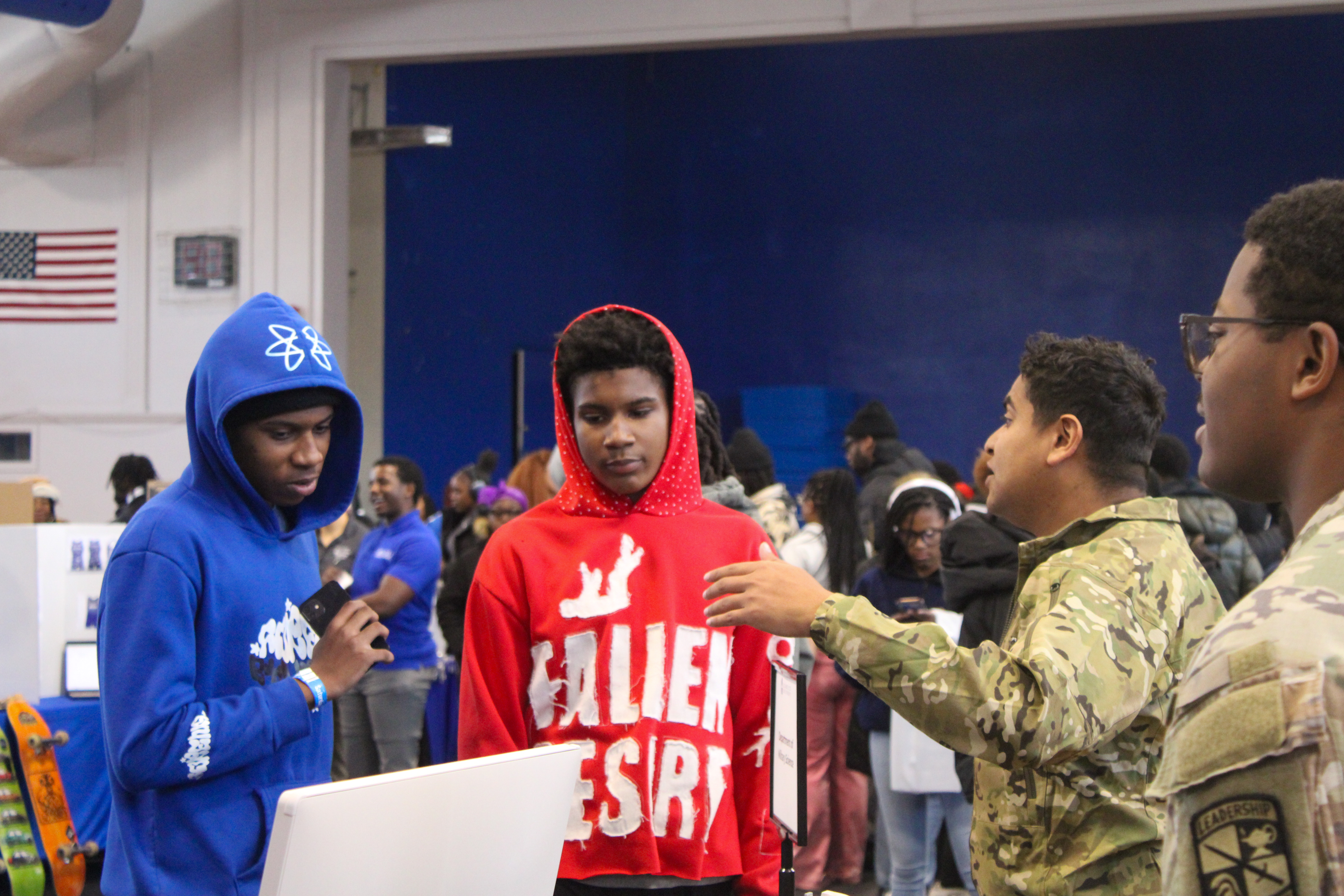 Prospective students at Open House speaking with Military Science representatives